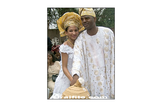 Igbo Wedding Picture 9 the cutting of the cake - shaped like a gourd.